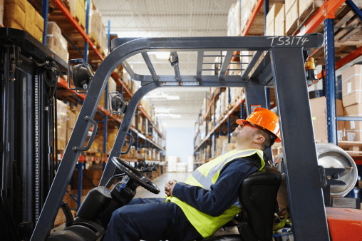 A man is sleeping in the wearhouse representing Job site Wreck - The Law Man Group, APC.